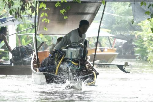 Long tail boats on a rainy day in Thailand
